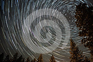 Universe spiraling around north star on night sky