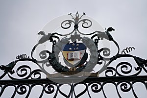 university of Adelaide logo iron fence