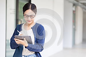 University Asian teen girl using tablet online learning modern education lifestyle in school campus