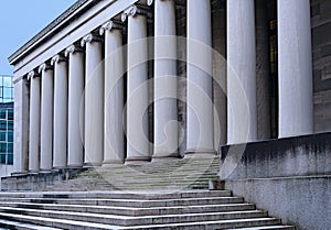 University building with steps leading to portico of ionic columns