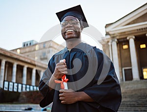 University diploma, graduation and portrait of a black man at campus to celebrate success in school. Scholarship, pride