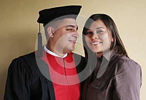 University graduation celebrates his graduation with his girlfriend