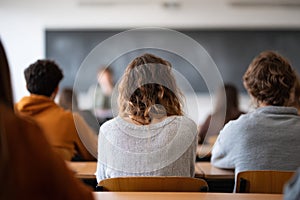 University Lecture Hall with Students Seen from Behind