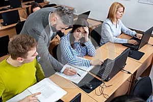 University professor lecturing small group of students