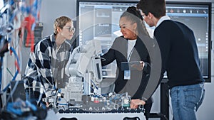 University Robotics Class: Black Teacher Explaining Engineering to Students And Using Robot Arm