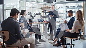 University Robotics Class: Teacher Explaining Engineering to Students by Using Robot Arm. Diverse