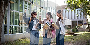 University student friendship concept with classmate friend walk together at campus college park. Youth teenage and