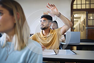 University student, hands and answer question in classroom for teaching, school education or learning. Young man