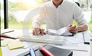 University student working in library with homework after study class