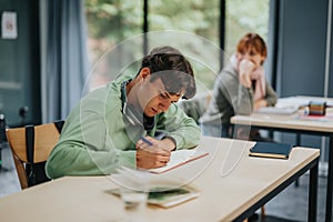 University students focused on their studies in a modern classroom environment.