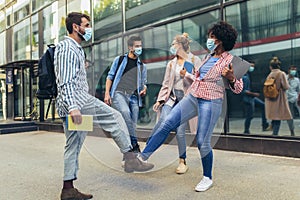 Students shaking legs outdoors, coronavirus and back to normal concept