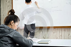 University students study hard and listen to teachers for their lessons with special lectures in the columns of math class