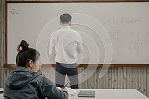 University students study hard and listen to teachers for their lessons with special lectures in the columns of math class