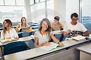 University students studying together in classroom