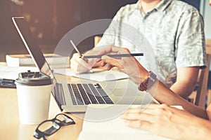 University students using laptop for research homework in college