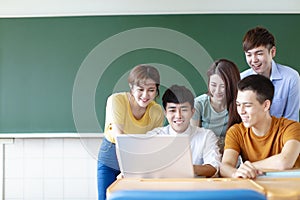 University Students Using Laptops In classroom