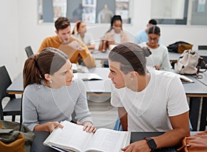 University, studying and friends talking about education while learning from a textbook in the classroom. Students