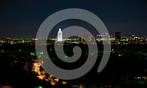 University Tower Lit up at night in Austin Texas city view from Mount Bonnell photo