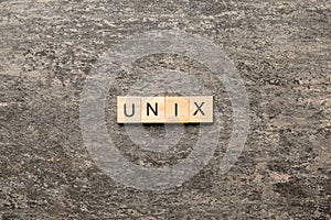 Unix word written on wood block. Unix text on table, concept