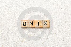 Unix word written on wood block. Unix text on table, concept