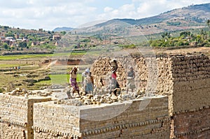 Unknown Africans working hard in brickyard - Madagascar