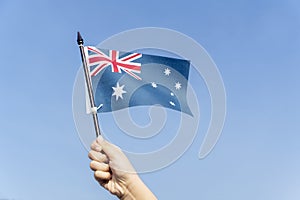 Unknown child waving an Australia flag