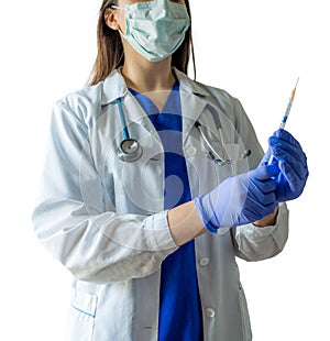 Unknown female doctor in medical uniform with mask holding a syr