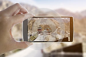 Unknown hands take photo the Great Wall of China