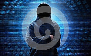 Hooded computer hacker standing over binary code