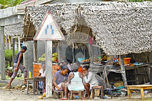 Unknown Malagasy People seeling traditional food.