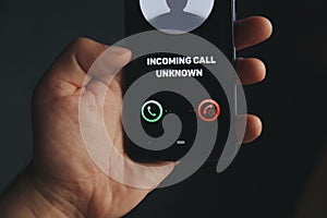 Unknown number calling in the middle of the night. Phone call from stranger. Person holding mobile and smartphone home