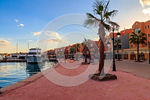 Unknown people walking on New Marina boulevard in Hurghada