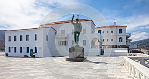 Unknown Sailor Statue in Andros island, Greece. Riva square in Chora town