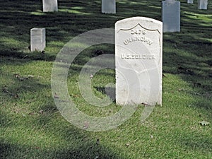 Unknown US Soldier Sunlit Headstone. photo