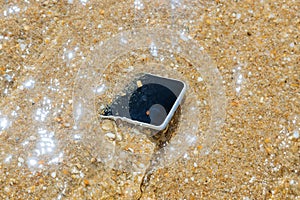 unknown woman has dropped her phone into the water