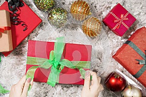 Unknown woman preparing Christmas gift