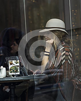 An unknown woman sits in a Chicago cafe