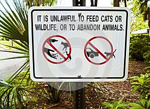 Unlawful to Feed Cats, Wildlife or Abandon Animals Sign