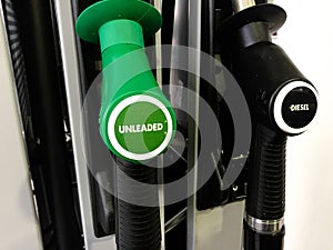 An unleaded and diesel fuel nozzles at a service station