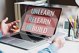 Unlearn,relearn,rebuild text on laptop,human performance photo