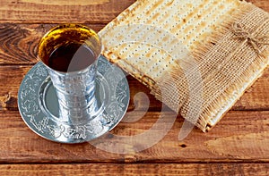 An unleavened bread matzah a Pesach symbols are Passover wine cup