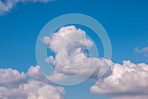 The unlimited and blue sky with big and white clouds