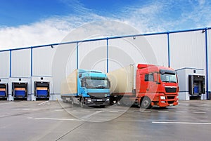 Unloading cargo truck at warehouse building