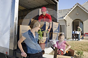 Unloading Delivery Van By New House