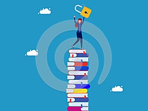 Unlock education or learning. Woman holding key standing on high pile of books