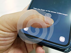 Unlock mobile phone using biometrics thumbprint