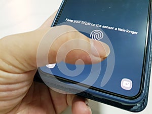 Unlock mobile phone using biometrics thumbprint