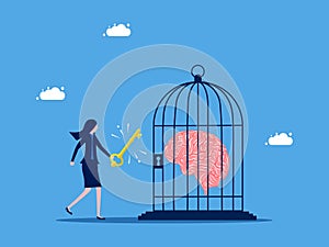 Unlock your freedom of thought. Businesswoman unlocks the brain in the cage