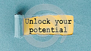 UNLOCK YOUR POTENTIAL - words written under ripped and torn paper