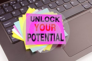 Unlock Your Potential writing text made in the office close-up on laptop computer keyboard. Business concept for Self-Development